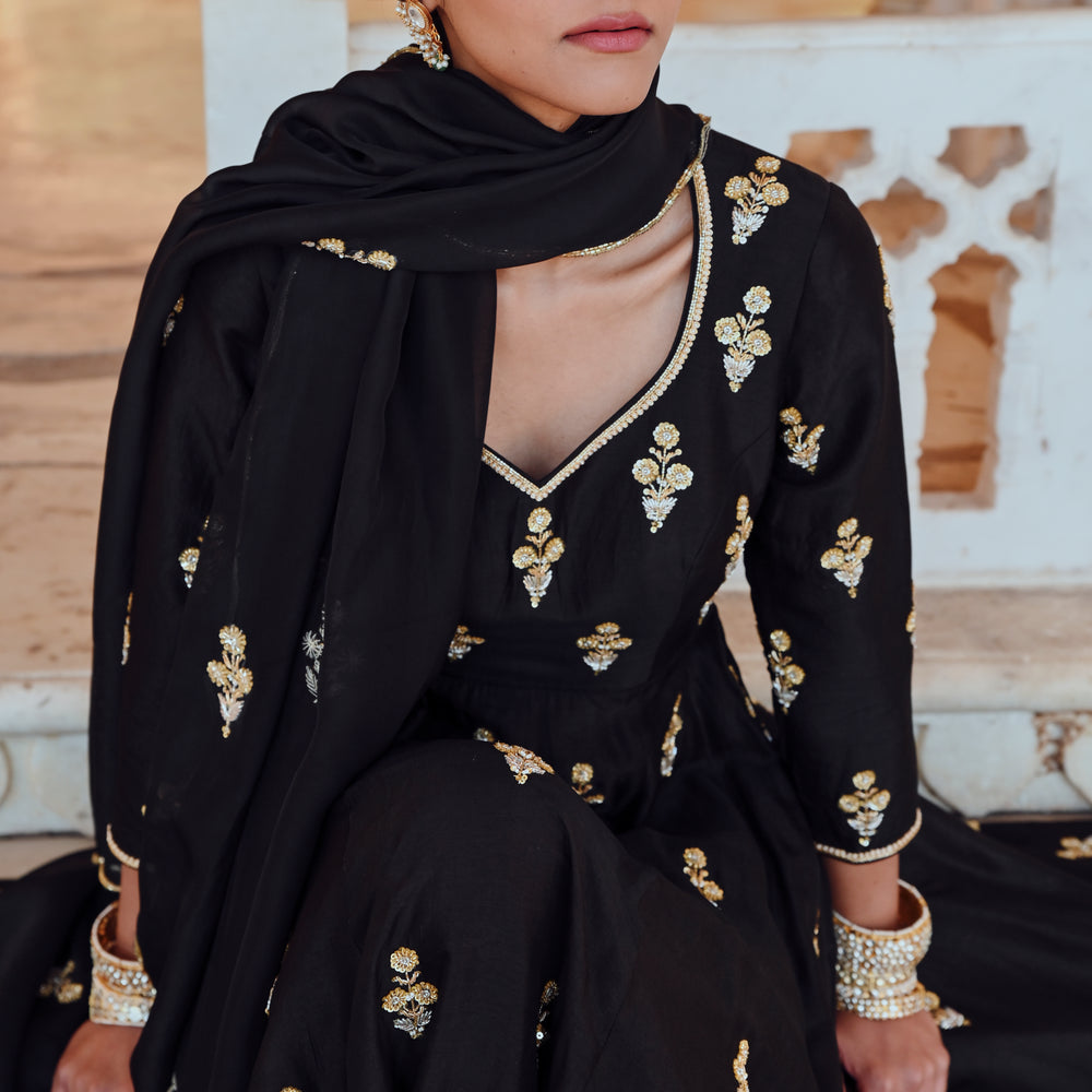 
                      
                        BLACK FLORAL BUTTI EMBROIDERED 12 KALI ANARKALI WITH PALAZZO & DUPATTA
                      
                    