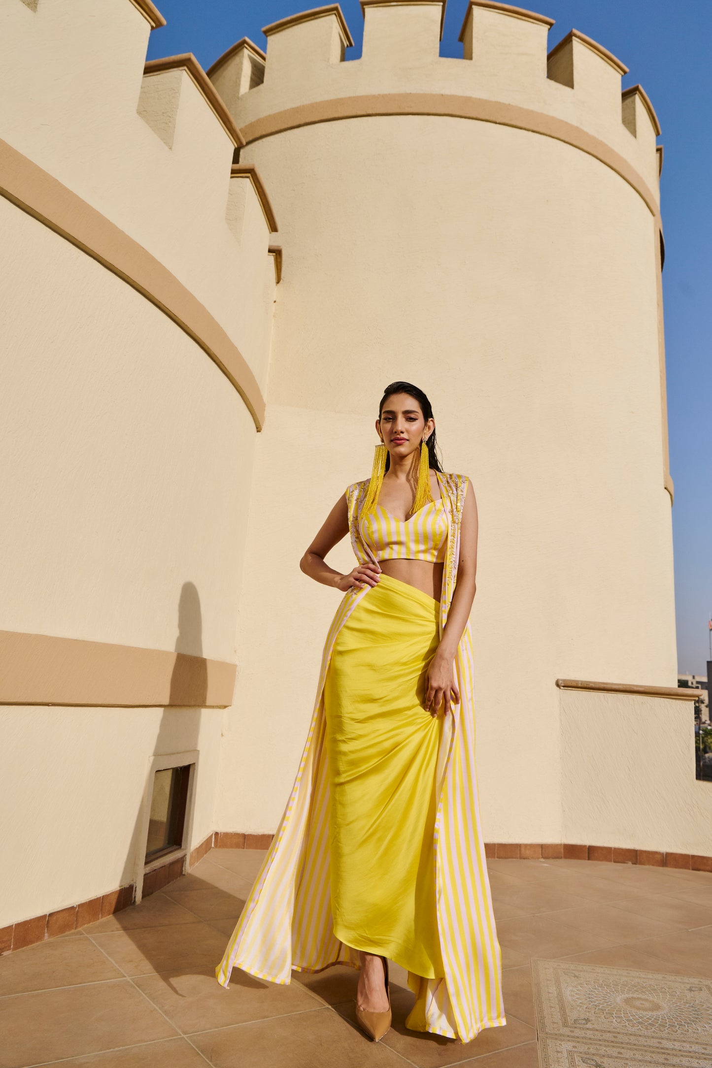 YELLOW STRIPED JACKET WITH DRAPED SKIRT AND BRALETTE