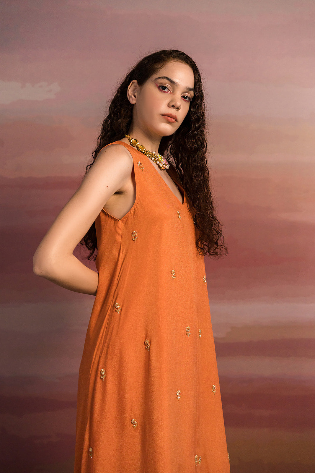 Rust Loose Kurta With Striped Pants.