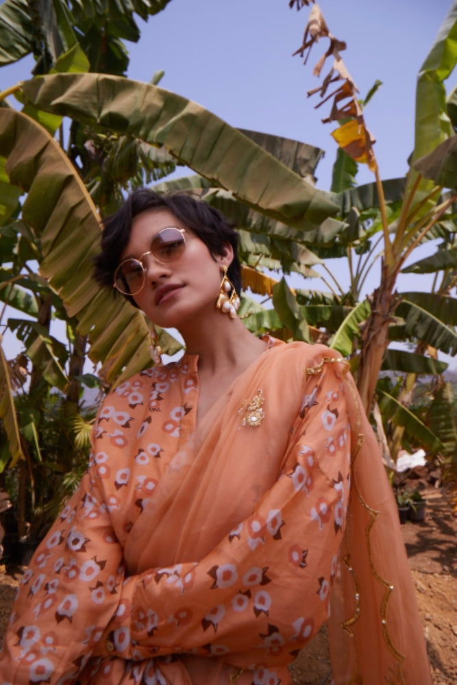 
                      
                        Peach Organza Saree with Shirt Blouse
                      
                    