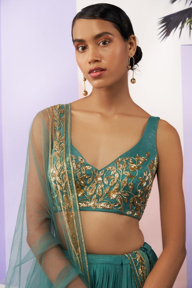 
                      
                        Turquoise Lehenga
                      
                    