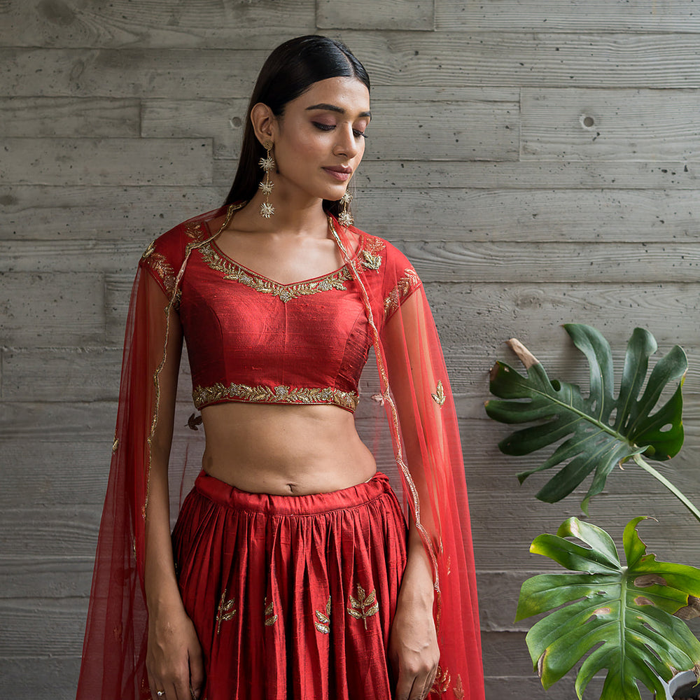 
                      
                        RED LEHENGA
                      
                    