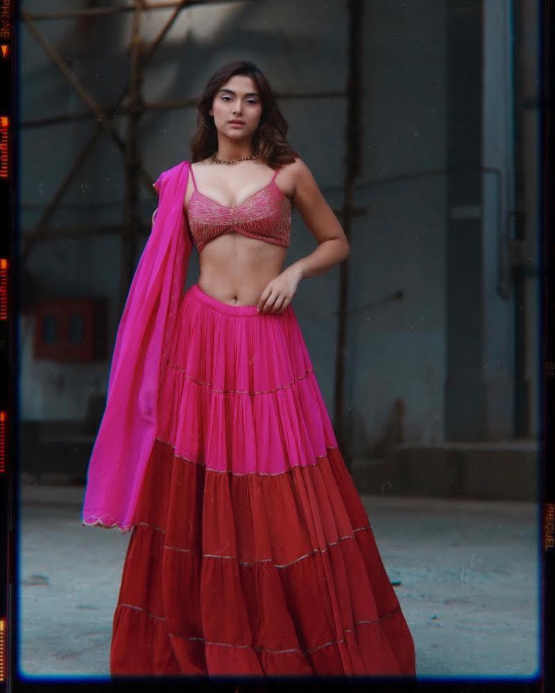 
            
                Load image into Gallery viewer, Saiee Manjrekar in Rani Pink-Red Tier Ghagara Set
            
        